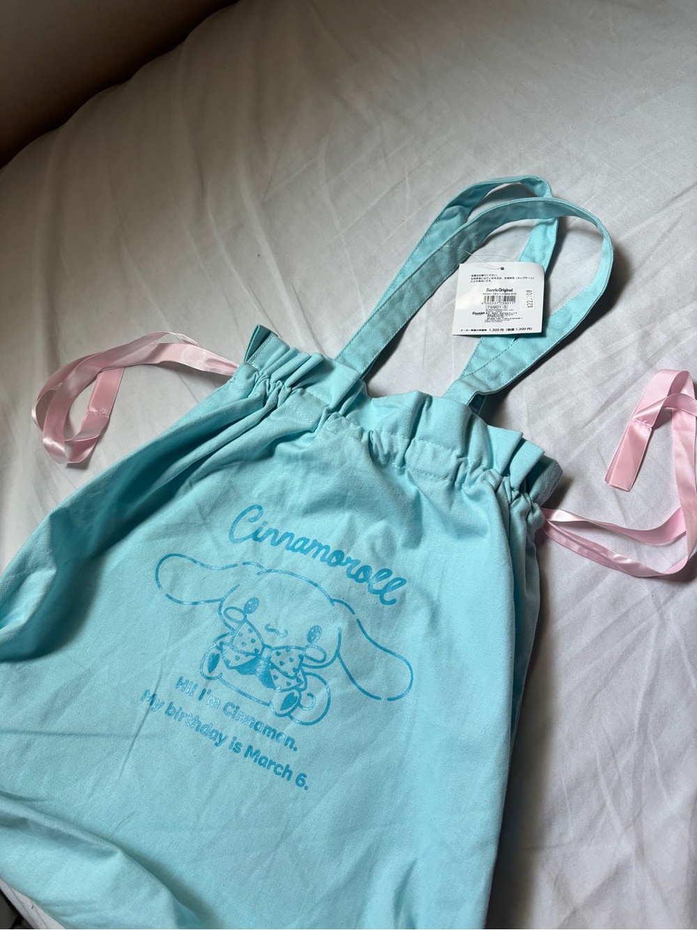 Sanrio Cinnamoroll Drawstring Tote Bag in aqua with pink accents